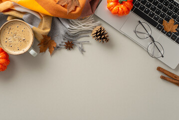 The comfort of remote job concept. Above view image of laptop with pumpkin decor, maple leaves,...