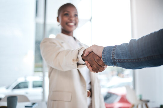 Black woman, handshake and meeting in partnership, support or trust for teamwork or unity at office. African female person or employee shaking hands for introduction, agreement or deal at workplace