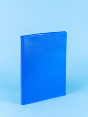 Blue plastic folder  for documents isolated on blue  background