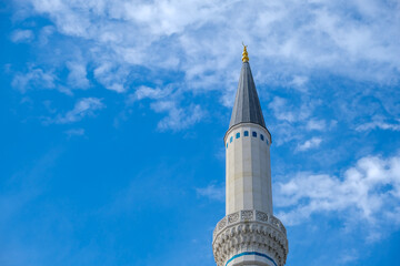 Çamlıca Mosque minaret and domes details with blue sky background. Eid Mubarek background concept. Selective focus included. Open space area for writing. 