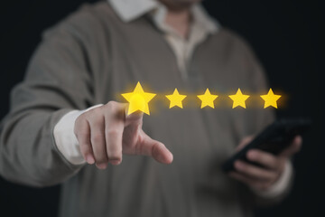 Businessman Selecting Five Star Satisfaction Rate on Virtual Screen on Mobile App for Positive Feedback : Modern Success in Digital Communication or Complacent Achieving Excellence in User Experience