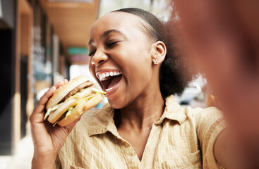 Burger, eating and woman in selfie, city and restaurant outdoor promotion, social media and live streaming review. Fast food, hungry and african person, customer or influencer with lunch photography