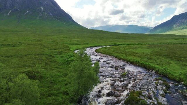 Buachaille Etive M&ograve;r and Waterfall from a drone, River Coupall, Glen Etive and River Etive, Highlands, Scotland, UK