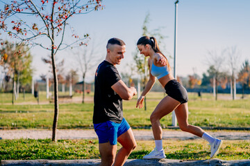 Couple balacing on the tree. The girl is the winner