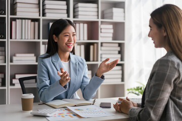 Businesswoman discussion about new project of business and finance document with partner in office