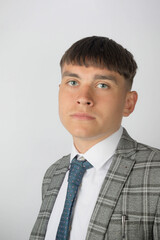 Young entrepreneur wearing a suit and tie looking worried