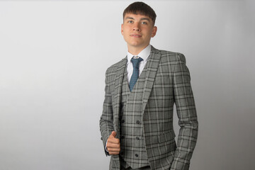 Young entrepreneur in a suit, tie and waistcoat