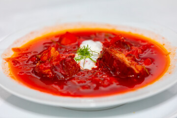 Traditional Ukrainian or Russian soup borscht on wooden table. Prudentópolis PR