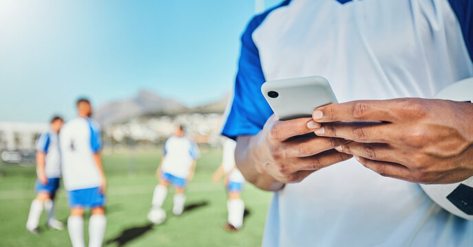 Football, field, phone and man hands for competition, training or fitness news, social media chat and blog. Soccer player or person typing on mobile app for sports information, health or goal check