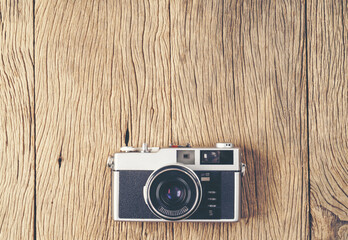 vintage old film camera on wood board