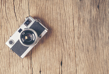 vintage old film camera on wood board