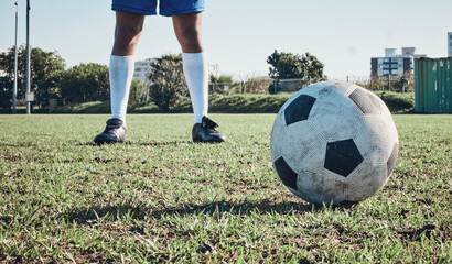 Sports, soccer ball and feet or shoes of person to kick on field, fitness training or ready for a...