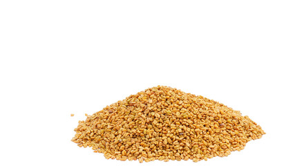 Fenugreek or Methi Dana seeds on pile. Fenugreek seeds background, spice, culinary ingredient