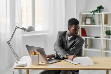 Fototapeta premium man laptop office computer job student freelancer american online career african education