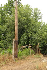 A wooden pole in the grass