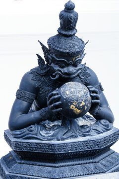 Phra Rahu the name of Thai and India god, The black giant eating the moon. Phra Rahu statue At Watpalalai