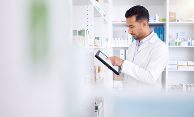 Pharmacist, medicine and Asian man with tablet to check inventory, stock or healthcare for online prescription. Pharmacy, medical worker or employee with pills, health products or internet connection