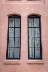 Fototapeta na wymiar Close up of the color windows of a colonial era home in Charleston, South Carolina