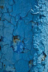 Rust on a blue surface. Cracks in the paint. Old iron. Rusty stains on metal. Background water column