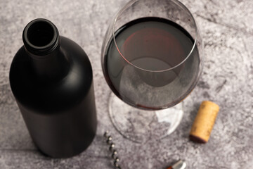 Red wine glass and bottle top view