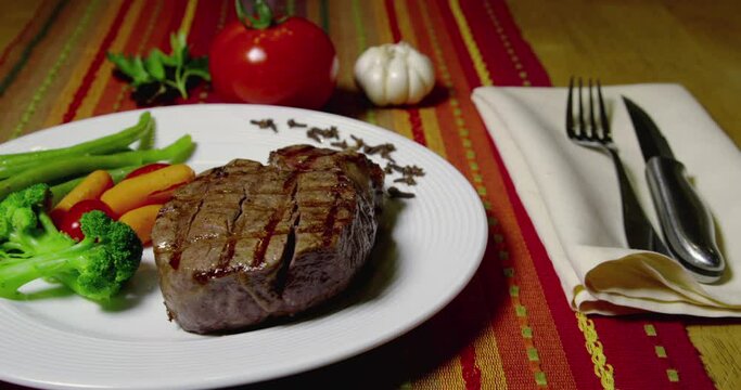 Filet Mignon And Vegetables On White Plate