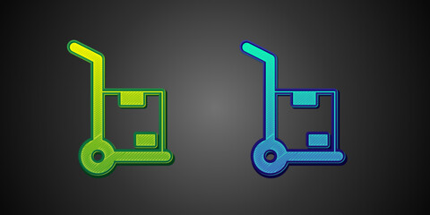 Green and blue Hand truck and boxes icon isolated on black background. Dolly symbol. Vector