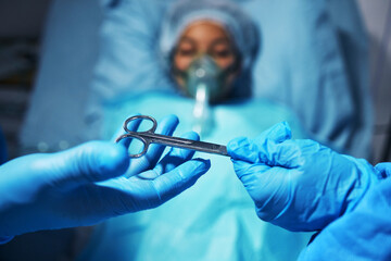 Hands, scissors for operation and a surgeon team with a patient in the hospital emergency room....