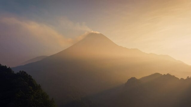 4K Aerial hyperlapse flying to mount Merapi active volcano at sunrise, Java, Indonesia 
