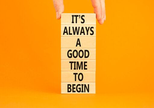 Good time to begin symbol. Concept words It is always a good time to begin on wooden blocks on a beautiful orange table orange background. Business motivational good time to begin concept. Copy space