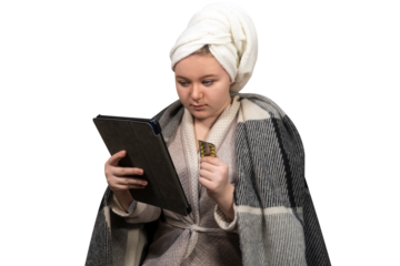A girl with cold symptoms holds a blister of pills in one hand and a tablet computer in the other on a transparent background. Online consultation