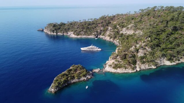 Drone aerial view of luxury private yacht in the mediterranean azure sea at sunny summer day