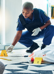 Police woman, crime scene investigation and floor for proof, murder or forensic analysis with focus. Law enforcement officer, murder and monitor evidence with experience, problem solving and justice