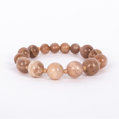 Beige natural stone, Sunstone bracelet. Three different sizes of the stones and small crystals between.