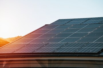 Solar panels on the roof of the modern house. Residential house cottage with blue shiny solar photo...