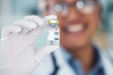 Healthcare, hands and vaccine and medicine bottle with doctor in blurry background. Innovation,...