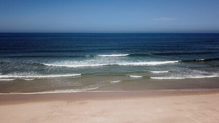 Ocean waves crashing on beach