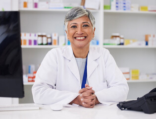Portrait, pharmacist and smile with professional for happiness at chemist for medicine or help. Mature female, pharmacy and face with smile for medicine with customer service in retail healthcare.