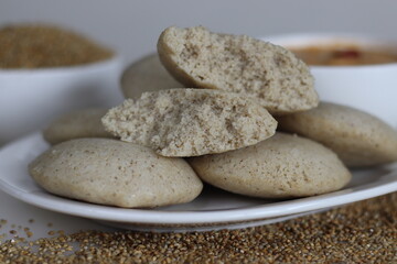 Bajra idly. Steamed savory rice cake made by a batter of fermented de husked black lentils and unpolished pearl millet