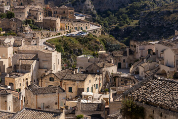 View of the city of Matera by day. Typical Salento illuminations during the holidays. Feast of the Brown Madonna, Matera. Prehistoric caves from the Murgia.Mysterious and ancient land among the stones