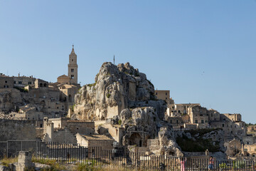 View of the city of Matera by day. Typical Salento illuminations during the holidays. Feast of the Brown Madonna, Matera. Prehistoric caves from the Murgia.Mysterious and ancient land among the stones