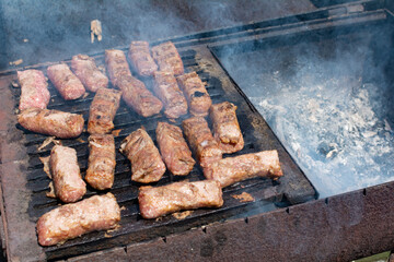 Mititei. Mititei or mici, typical romanian and moldavian food grilled ground meat rolls made from a mixture of beef and lamb and spices