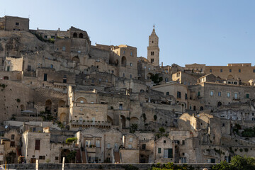 View of the city of Matera by day. Typical Salento illuminations during the holidays. Feast of the Brown Madonna, Matera. Prehistoric caves from the Murgia.Mysterious and ancient land among the stones