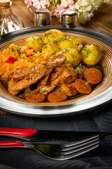 Stewed turkey meat with chorizo sausage.