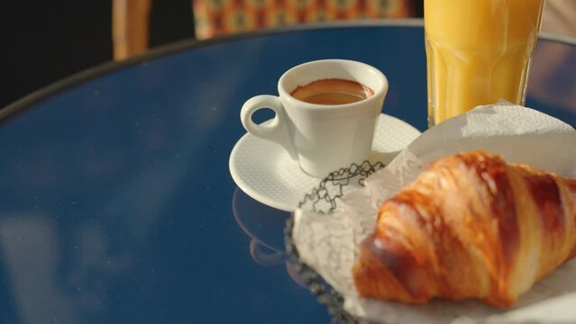 French breakfast coffee and croissant on the table indoors