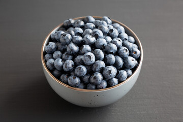 Organic Blueberries in a Bowl, side view.
