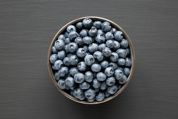 Organic Blueberries in a Bowl, top view. Flat lay, overhead, from above.
