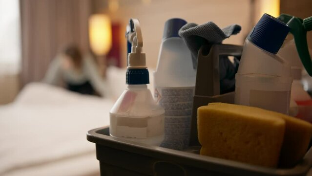 cleaning products are on the table in the hotel room before cleaning the concept of cleanliness and hospitality