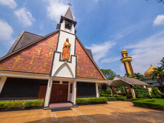 Jakarta, Indonesia (July 8, 2023): Church of Santa Katarina Dari Siena close to the mosque is in...