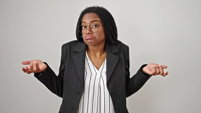 African american woman business worker standing clueless over isolated white background