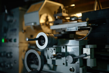 Fototapeta na wymiar Professional lathe turning machine at motorcycle garage workshop